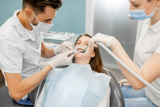 istock Patient with dental braces during a regular orthodontic visit 1300714879