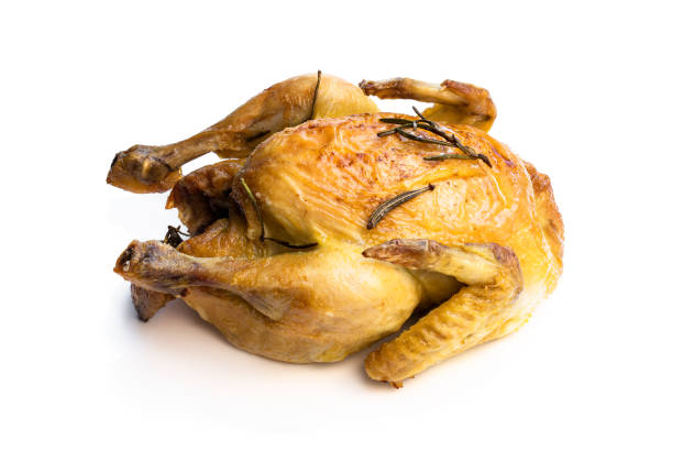 istock Raw whole corn fed poussin in clear glass bowl isolated on white background 1300715586