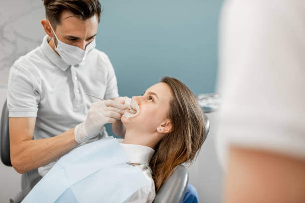 istock Patient with dental braces during a regular orthodontic visit 1300715936