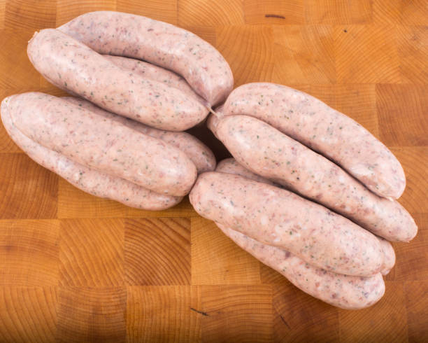 istock Award winning sausages on butchers block 1300718369