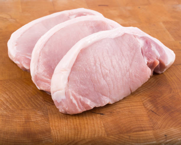 istock Raw sliced Pork steak on butchers chopping block 1300719115