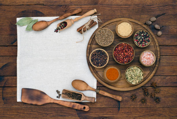 istock Spices and condiments for cooking on wooden background 1300719329