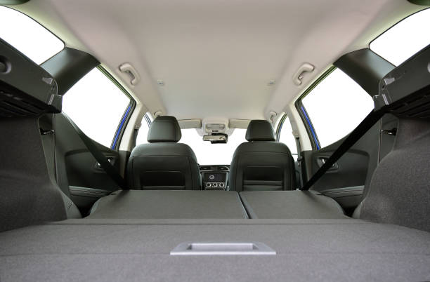 istock Trunk of car with rear seats folded, inside view 1300720373