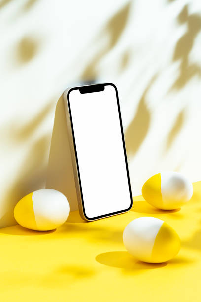 istock Eggs and phone mockup, template on yellow and white background 1300721443