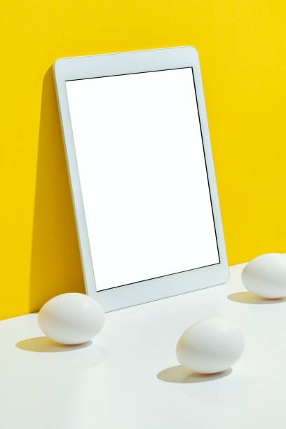istock Eggs and phone mockup, template on yellow and white background 1300721461
