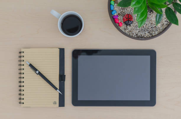 istock MockUp Tablet Notebook and Pencil and coffee 1300723153