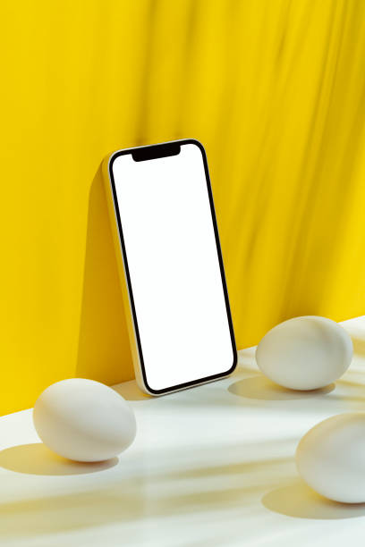 istock Eggs and phone mockup, template on yellow and white background 1300723465