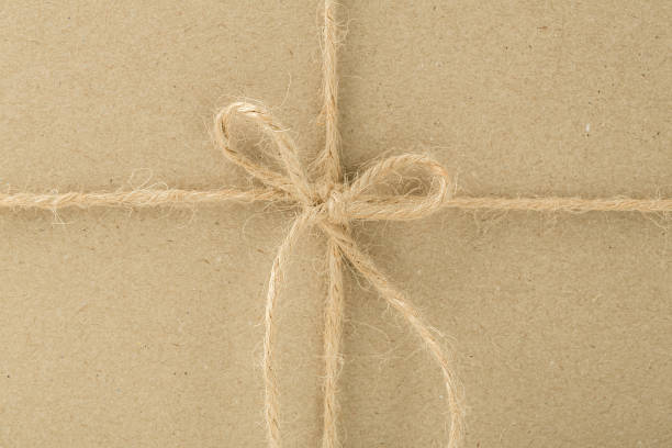 istock packaging in craft paper and tied with twine 1300724156