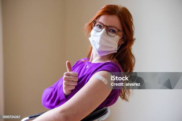 Woman Showing Thumbs Up After Getting Covid19 Vaccine Stock Photo - Download Image Now