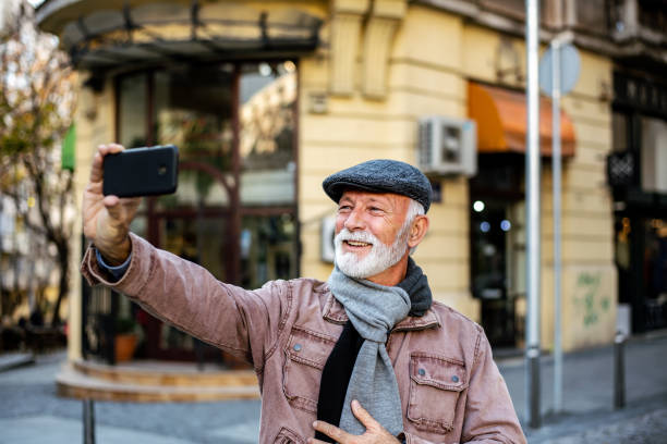 istock Mature business man taking selfie 1300724471