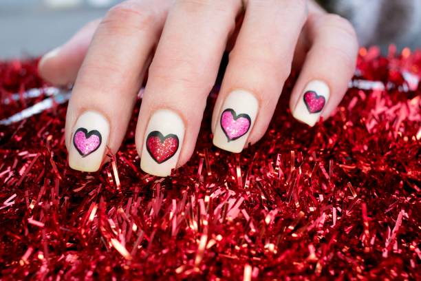 istock Glitter Hearts Nail Art Design 1300724658