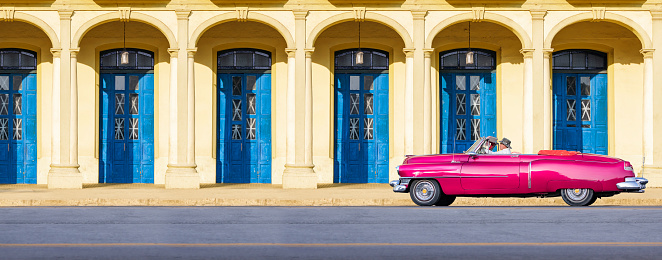 Vintage blue oldtimer car driving through Old Havana Cuba