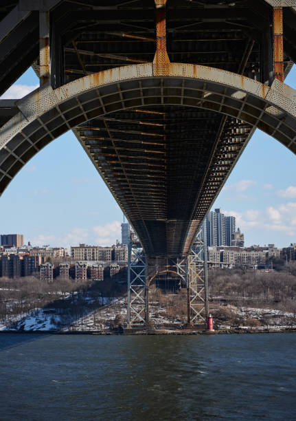 The steel and iron arches of the George Washington Bridge looking across the Hudson River to the New York side The steel and iron arches of the George Washington Bridge looking across the Hudson River to the New York side gwb stock pictures, royalty-free photos & images