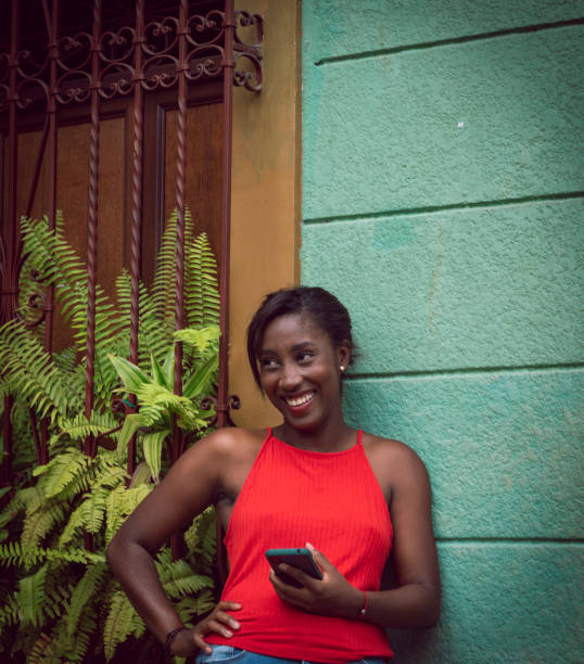 Photograph of a young, African American woman with a colorful background. Lifestyle in Cali Valle del Cauca Colombia.