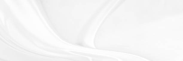 istock White gray satin texture that is white silver fabric silk panoramic background with beautiful soft blur pattern natural. 1300733840