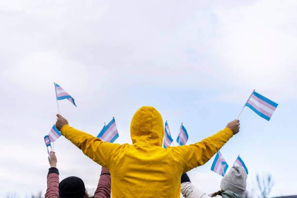 istock Young man holding two transgender high in the sky 1300739539