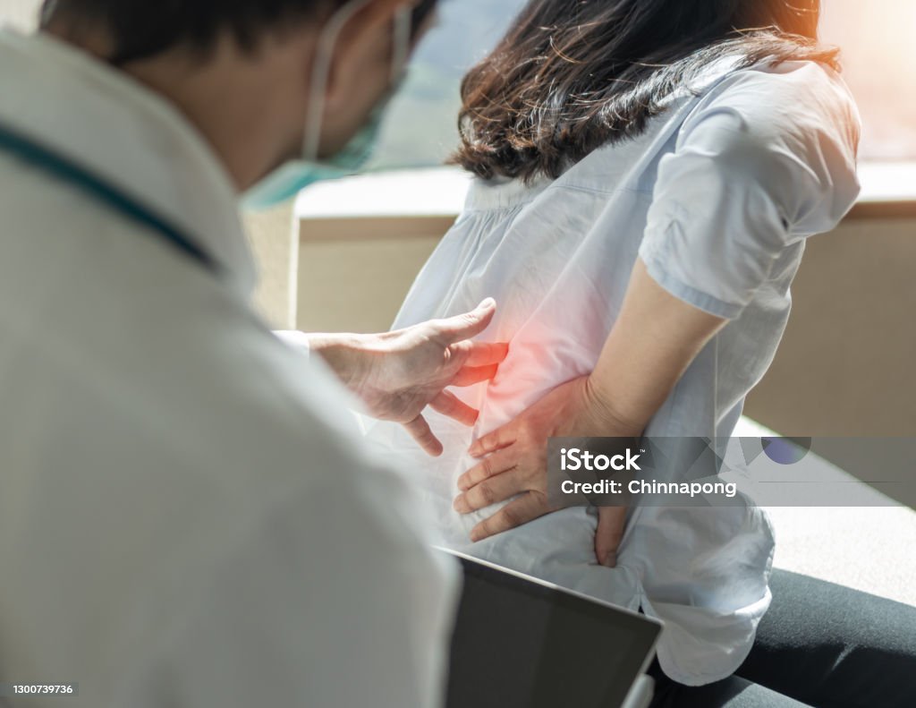 Lower back pain, back ache, muscle or spine injury in menopause woman patient with backache from osteoporosis disease or office syndrome seeing orthopedic surgical doctor for medical treatment Lower Back Pain Stock Photo