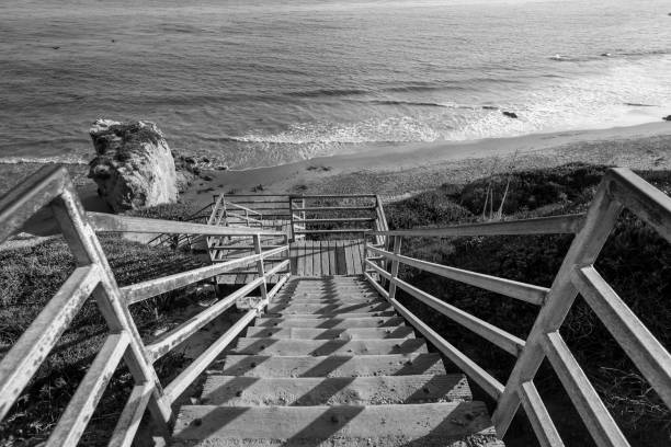 Black and white view of El Matador beach stairs near Malibu Los Angeles County, California.
