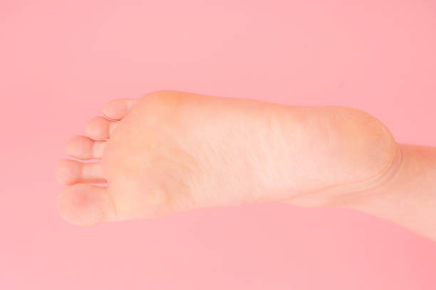 one foot isolated on white background.Beautiful neat foot. boy's foot.