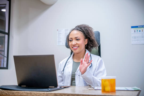 istock Female doctor meeting with patients virtually 1300755252