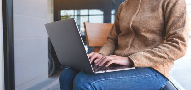 istock a woman working and typing on laptop computer keyboard 1300755420