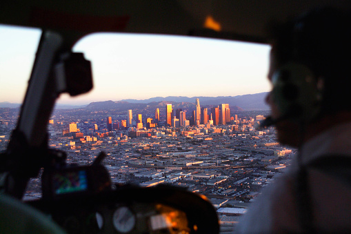 View through the pilot's windshield of helicopter of downtown Los Angeles, California, USA