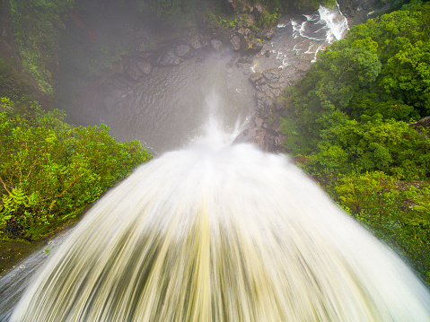 Aerial view of rushing waterfall in national park wilderness of Australia