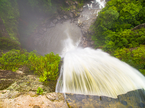 Aerial view of rushing waterfall in national park wilderness of Australia