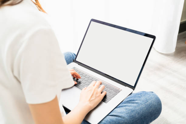 istock Woman using laptop with blank copy space screen for your advertisement. 1300761551