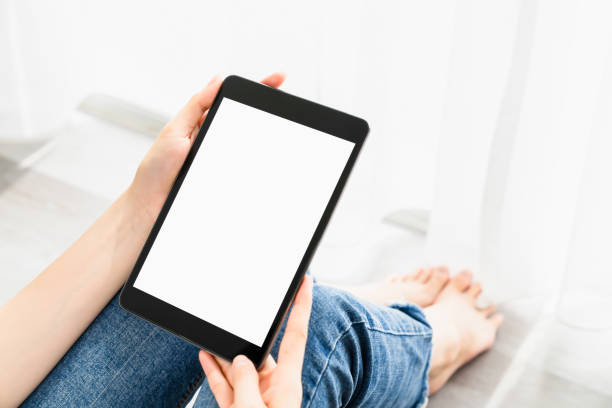 istock Woman hand using digital tablet and the screen is blank. 1300761557