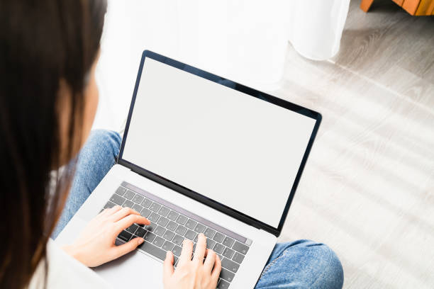 istock Woman using laptop with blank copy space screen for your advertisement. 1300761593