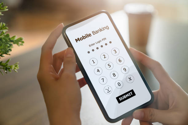 istock Female hands using mobile banking on smartphone and enter password to login application. 1300769746