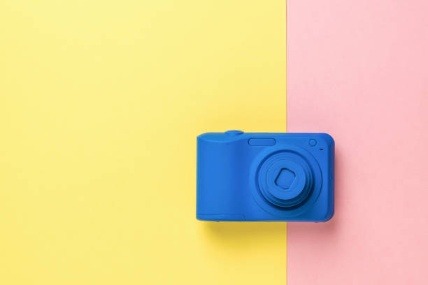 istock The camera is in a stylish blue color on a two-tone background. 1300770518