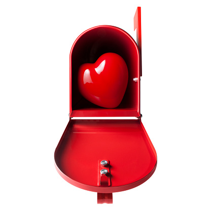 A red heart in a postal mailbox on white background.