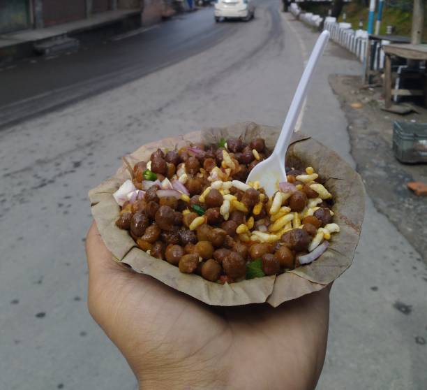 istock holding street food in hand 1300771536