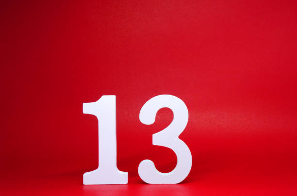istock No. 13 ( thirteen ) Isolated red  Background with Copy Space - Lucky or unlucky Number 13% Percentage or Promotion - Discount or anniversary concept 1300772553