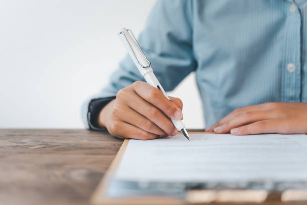 istock business man's hand is signing a contract In the agreement 1300776987
