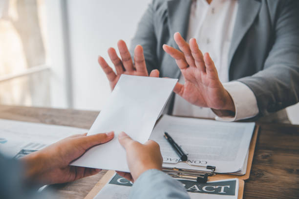 istock Businessmen refuse to accept dollar bills as a bribe for fraud. anti bribery and corruption concepts 1300777028