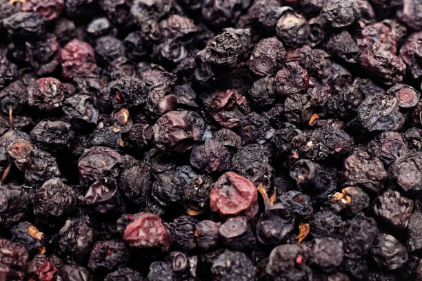 istock Bunch of dried blueberries close up, background 1300778142