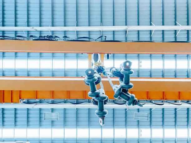 istock Overhead crane and machine inside factory building, industrial background 1300782428