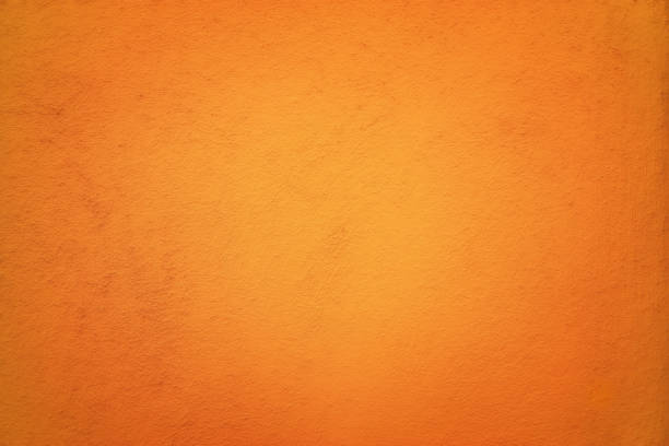 istock Red Orange colored abstract background with light glow and fine texture. 1300782480
