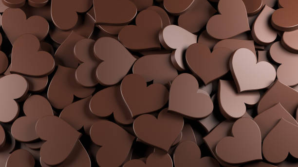 Milk chocolate hearts background, concept for holidays stock photo
