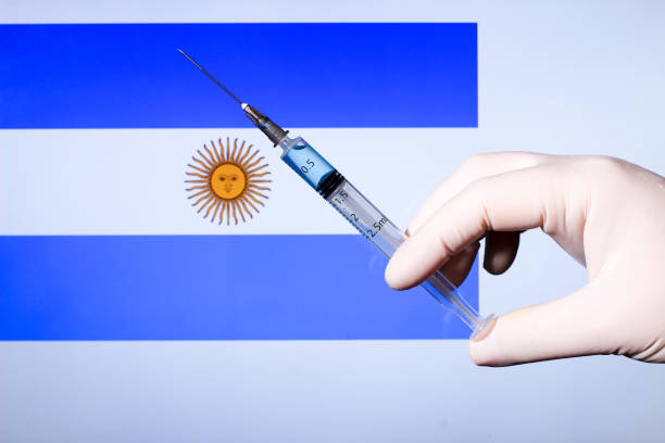 istock Hand holding syringe with covid vaccine 1300786918