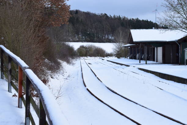 istock remote railroad station in snow 1300789332
