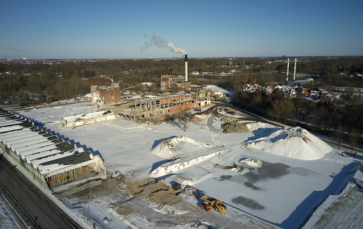 Old paper factory under demolition giving space for a new residential district. Dalum is a part of Odense city in Denmark. Aerial drone shots