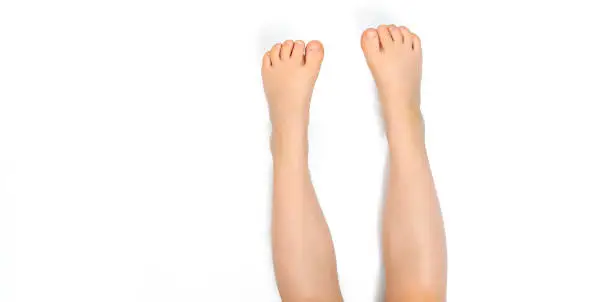 baby feet stick up on white background