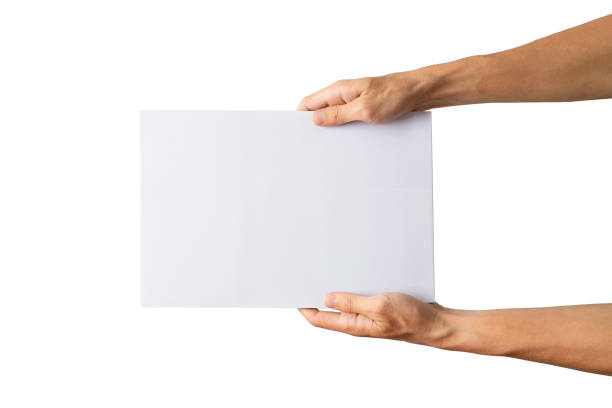 istock kid hands holding blank paper on white background 1300792482