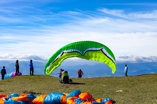 Paragliding sport over golden field, An Giang province