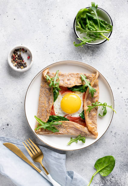 istock buckwheat crepe galette with egg, ham and spinach 1300793507