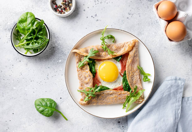 istock french buckwheat crepe with egg, ham and spinach 1300793532